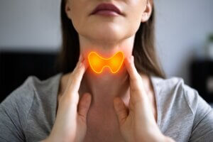 stimulating the thyroid gland